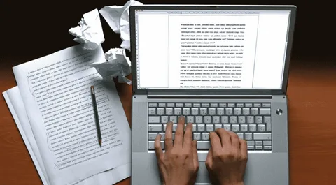 Student browsing top online assignment work websites on a laptop for academic help in 2024